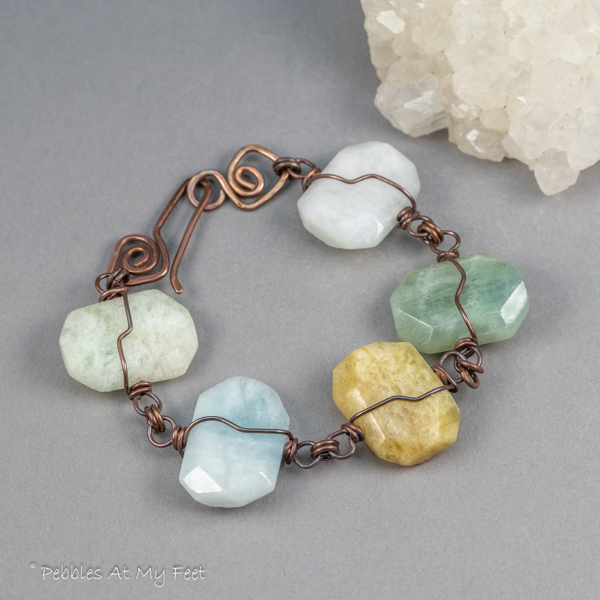 Handmade Copper Bracelet with Five Stone Slabs in White, Sage Green, Earthy Yellow, and Pale Blue Colors